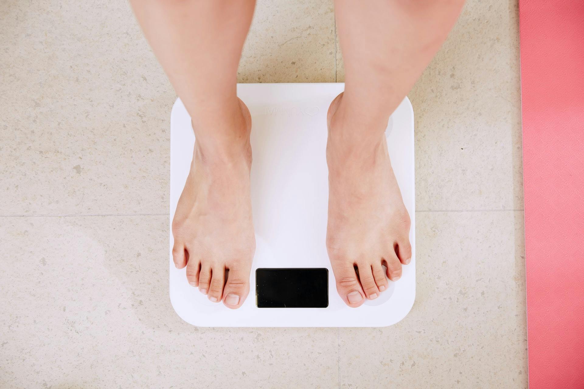 Feet on scale how does Medicare obesity therapy work.jpg